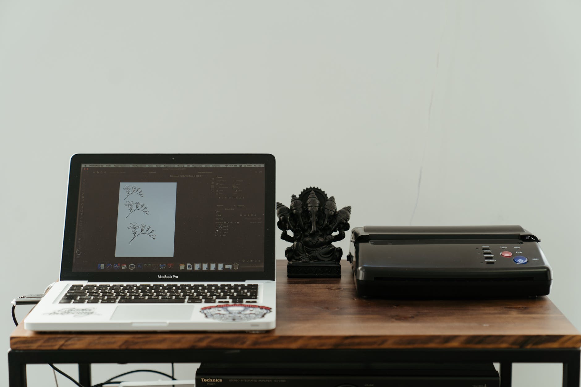 macbook pro on brown wooden table